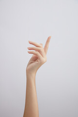 Hand model with a white background for cosmetic holding advertising , front view