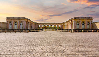 Fototapeta na wymiar Grand Trianon palace in Versailles park outside Paris at sunset, France