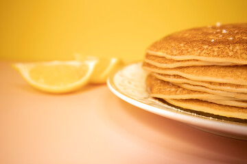 Russian pancakes on a white plate close-up