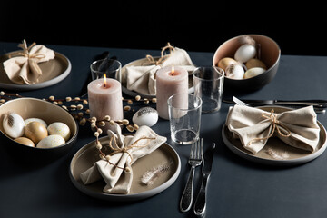 easter, holidays, tradition and object concept - close up of dinner party table serving over black background