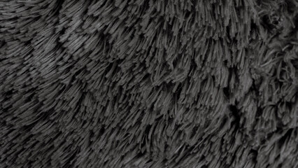 Black and gray texture of the soft fluffy fabric as background 
