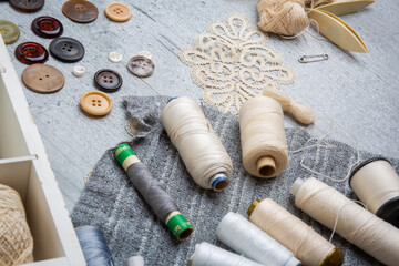 Fototapeta na wymiar Sewing supplies on a wood table