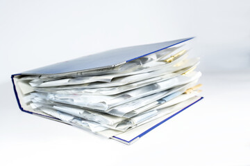 Large ring binder with clear punched pockets full of receipts, office management, accounting and...
