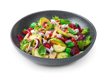 Vegetable salad with avocado, beetroot and feta seasoned with sesame and flax seeds on a white background.