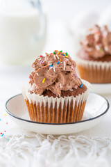Homemade chocolate cupcakes with chocolate whipping cream