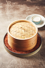 Traditional Asian bamboo steamer for steamed dumplings like Dim Sums or Manti. Asian food background