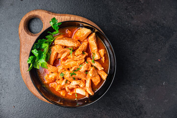 braised chicken meat tomato sauce chicken breast stew beef stroganoff second course healthy food fresh portion healthy meal food diet snack on the table copy space food background rustic top view