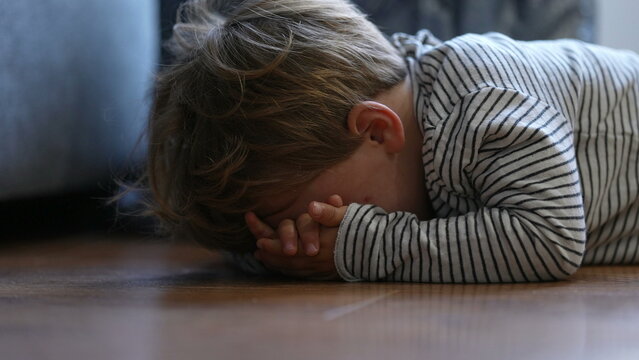 Child Crying On Floor Having Tantrum Little Boy Cries