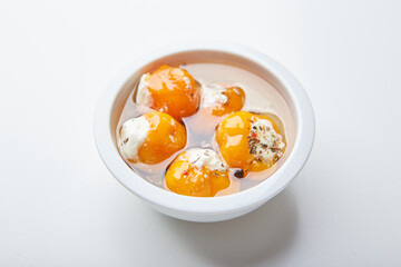 Pickled hot yellow tiny cherry peppers stuffed with soft cream or ricotta cheese. Delicious snack