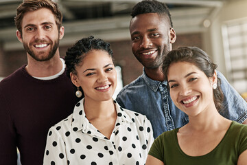 Obraz premium Theyve got all the qualities for a great team. Portrait of a team of colleagues working together in a modern office.
