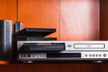 Obraz premium retro vhs tape player, wearing a jacket in the style of the 90s,