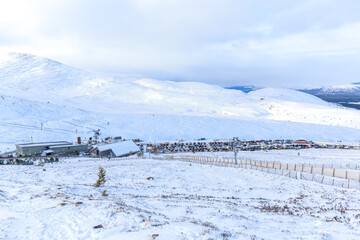 A Scenic view of a ski resort in the Scottish mountain during winter with snow 