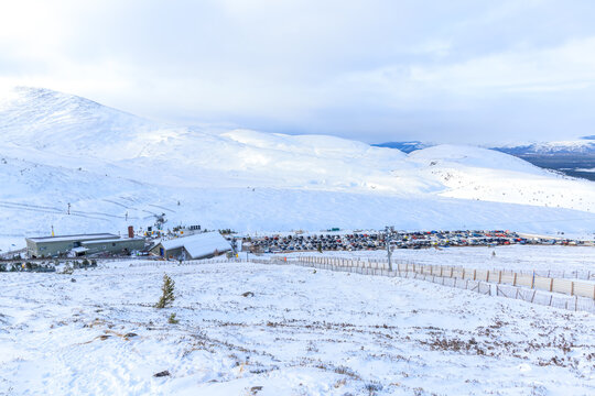 A Scenic view of a ski resort in the Scottish mountain during winter with snow 