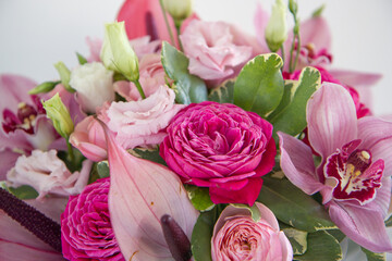 Composition of roses, eustoma and orchids, spring bouquet of flowers, flowers close-up