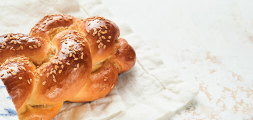 Challah bread. Sabbath kiddush ceremony composition. Freshly baked homemade braided challah bread...