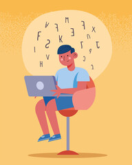 boy seated using laptop