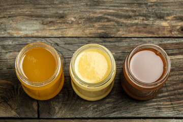 Macro photo of a bee hive on a honeycomb. Bees produce fresh, healthy, honey. Honey background. Beekeeping concept. Long banner format