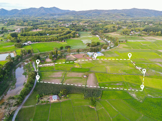 Land plot in aerial view, Top view land green field agriculture plant with pins, pin location icon for housing subdivision residential development owned sale rent buy or investment countryside suburbs - 487560587