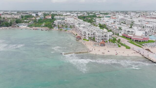People walking on Caribbean seafront promenade in Playa Del Carmen - aerial