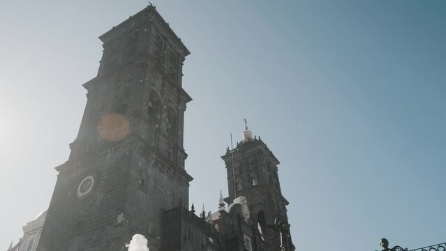 Bottom up shot of old historic Puebla Cathedral during beautiful sunny day with blue sky in Mexico