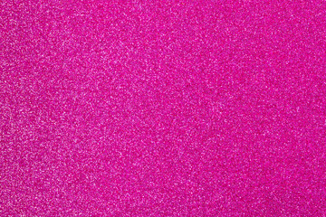 Pink wrapping paper background with a metallic sheen, copy space. Fashion texture, minimal concept, flat lay, top view