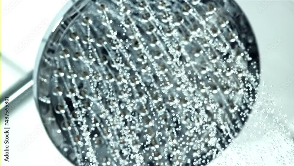 Sticker Water pours from the shower head. On a white background. Filmed on a high-speed camera at 1000 fps. High quality FullHD footage