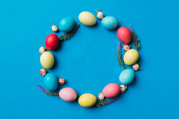 round frame Multi colors Easter eggs on colored background . Pastel color Easter eggs holiday concept with empty space for you design