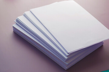 close up of stack of empty paper on table 