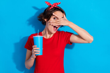 Photo of funny young brunette lady close face drink wear red t-shirt headband isolated on blue color background