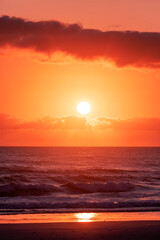 Gold coast beach colourful orange sky with clouds at sunrise