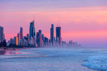 Colourful skies over Surfers Paradise skyline at sunset. View from Miami beach, Gold Coast
