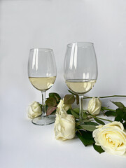 two glasses of champagne and roses