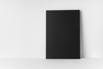 Empty chalk board on a white table