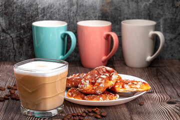 Morning breakfast cappuccino with pies on a wooden table. Morning coffee.