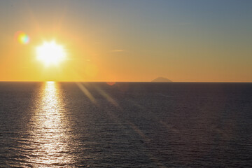 Sunset over the Mediterranean sea with clear sky. Sun over the water