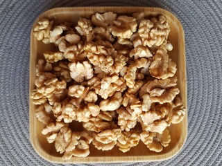 Walnuts on a wooden plate
