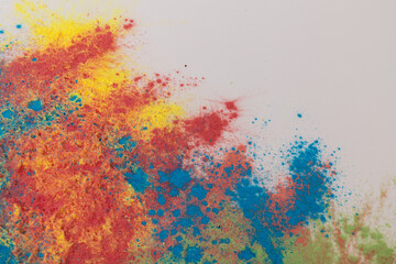 Freezing of colored powder explosions isolated on a white background