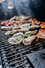 Seafood BBQ  barbecue. Collection of octopus, oysters, clam, tiger shrimps grilled on grill