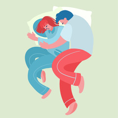 Cute young couple lying in bed and cuddling, view from the top.