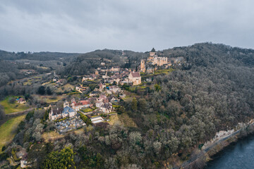 Fototapeta na wymiar Aerial view of an ancient medieval French village and Castelnaud-la-Chapelle Castle on the mountain in France