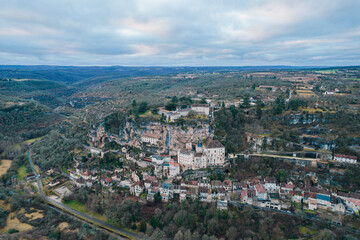 Fototapeta na wymiar Aerial view of an ancient french village and its castle on cliff, Rocamadour at dusk