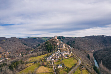 Fototapeta na wymiar Aerial view of Château de Najac (Castle of Najac) and Najac village on the hill in France