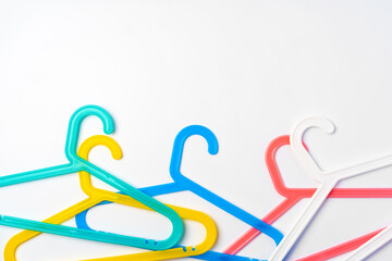 a pile clothes hangers on isolated white background