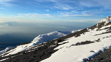 Fototapeta na wymiar Beautiful view of the disappearing glaciers of Kilimanjaro. Climbing Kilimanjaro