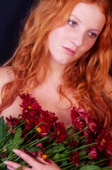 seductive sensual young sexy redhead valentine with a bouquet of flowers looking like botticelli's...