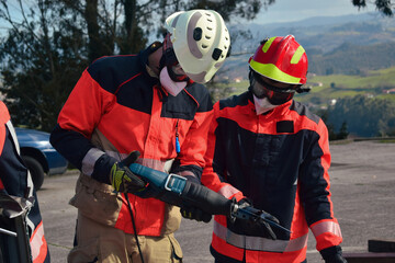 Firefighters looking at their tool before a rescue