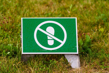 RIGA, LATVIA. 7th August 2021. No walking sign on the grass in park.
