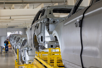 Photo of automobile production line. Modern car assembly plant. Modern and high-tech automotive...