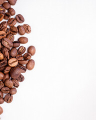 fragrant beans from the coffee tree in medium roast lie on a white background with a place for text