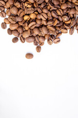 fragrant beans from the coffee tree in medium roast lie on a white background with a place for text